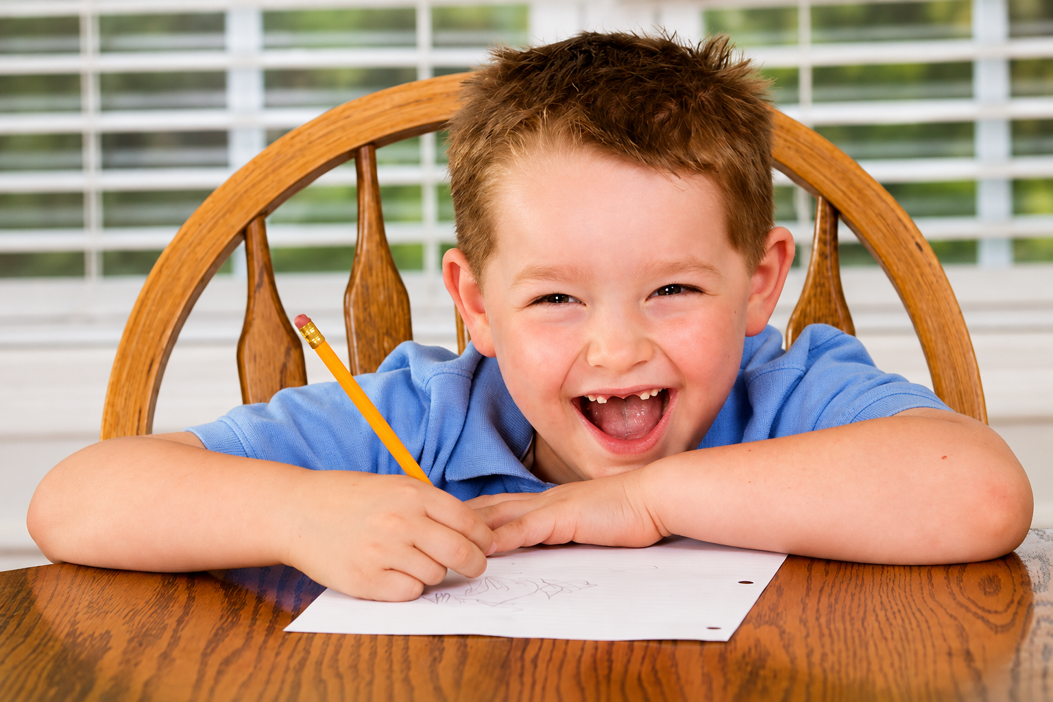 happy boy writing
